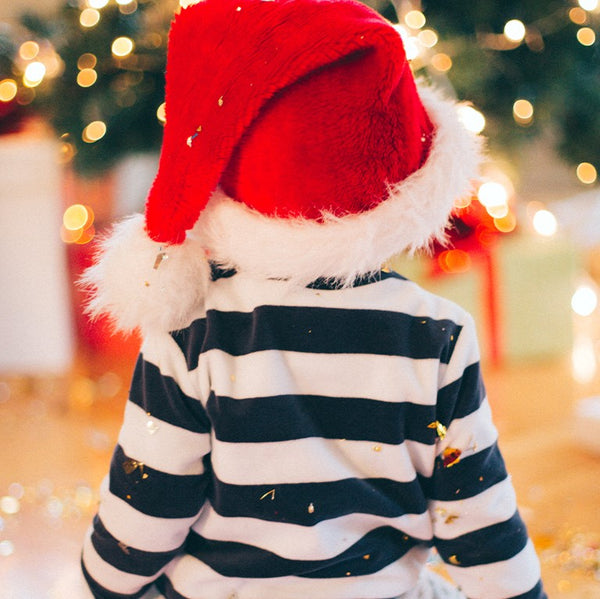 A child wearing a Santa hat.