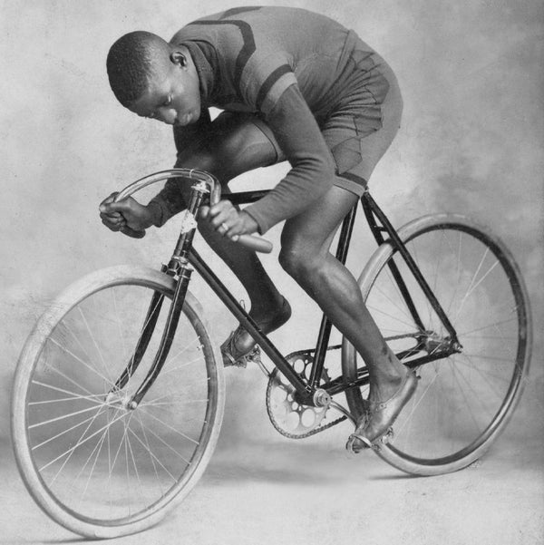 An old photo of Major Taylor riding a Schwinn bicycle.