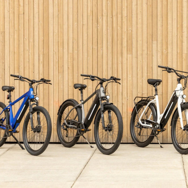 Three various Coston and Marshall electric bike models from Schwinn lined up in a row