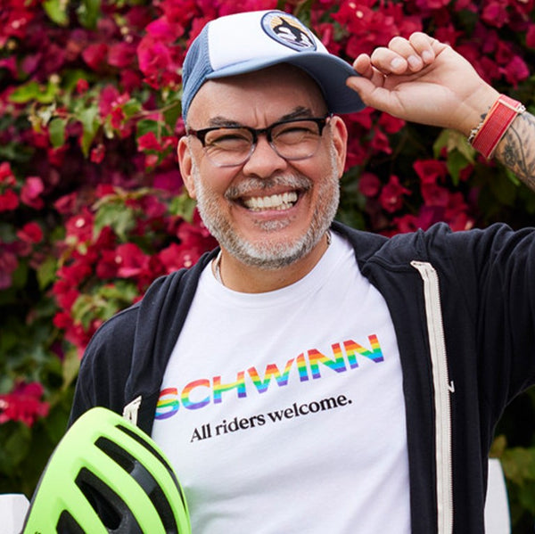 Schwinn ambassador, Matt Armendariz, smiling for a picture with his Schwinn Pride t-shirt.